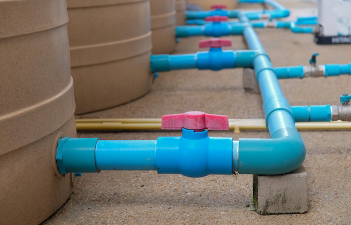 pipes leading into water barrels