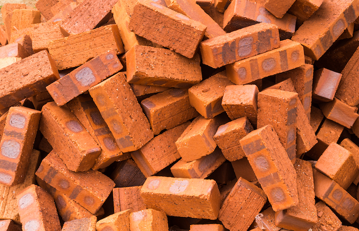 pile of red clay bricks