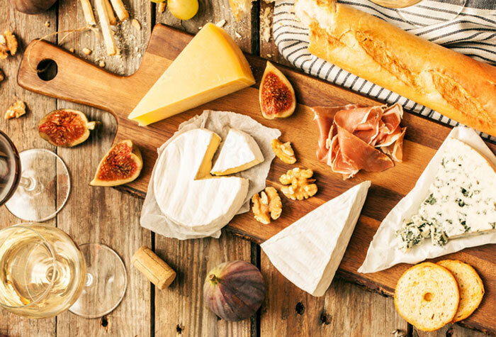 board of cheeses and breads