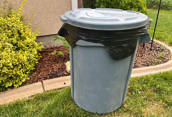 A large plastic garbage can is perfect to create your own rainwater collection system.