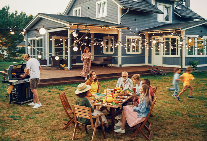 People creating a homestead community by throwing a BBQ together.