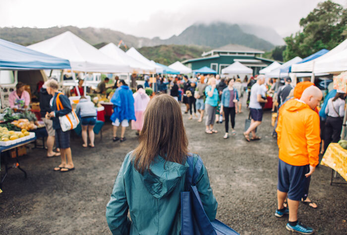 A woman attending a farmers market to find like minded people.